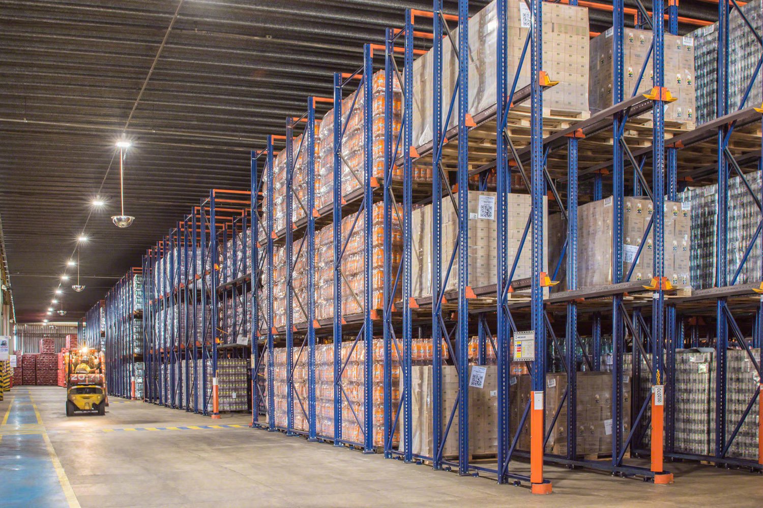 Store more pallets with fewer aisles using drive-in pallet racking.