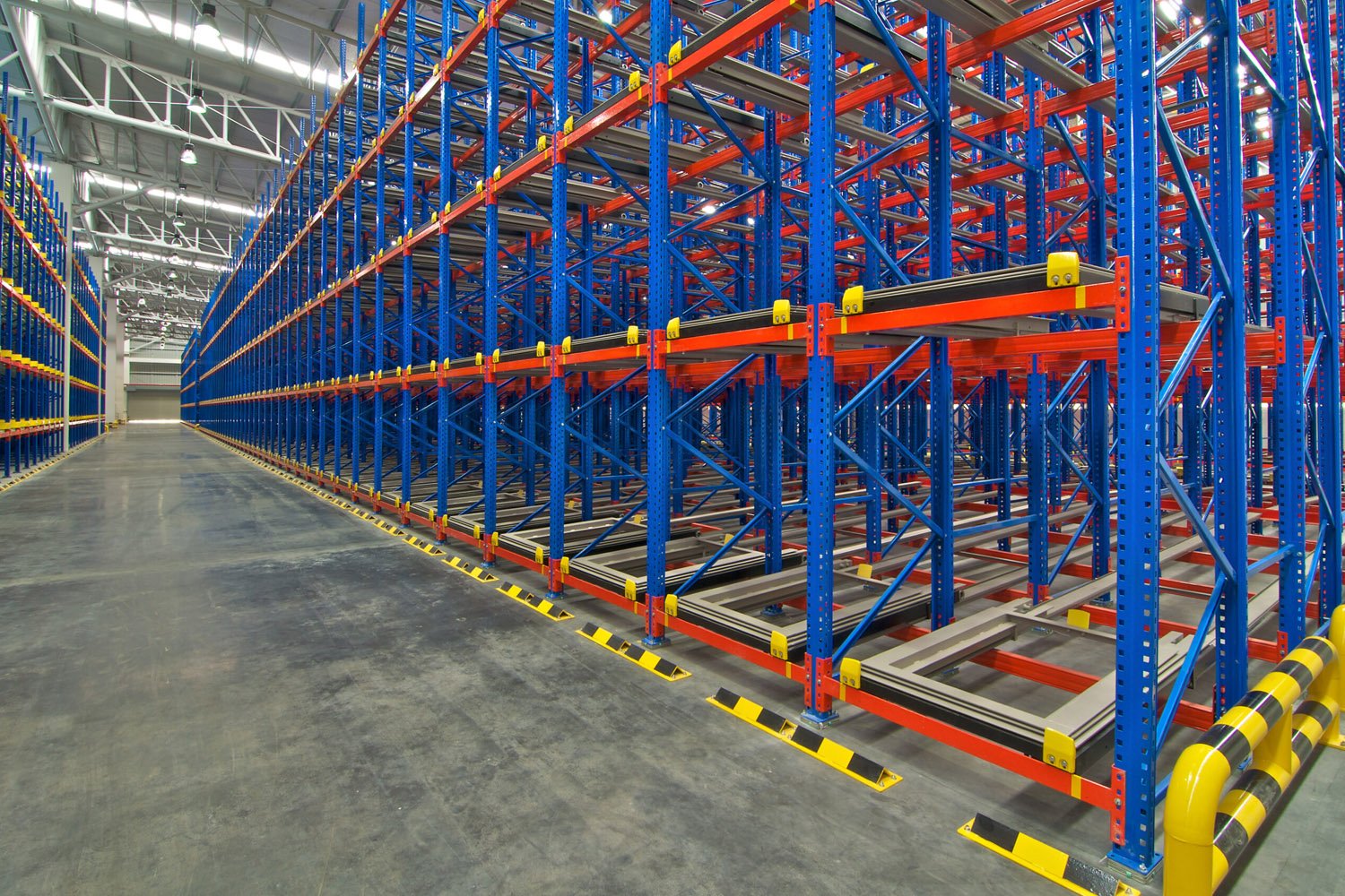 High-density push back racking designed to maximize space and speed up warehouse operations.